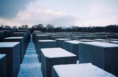 View of cemetery against sky during winter