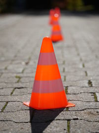 Traffic cones in row on footpath