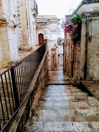 Narrow alley amidst buildings in city