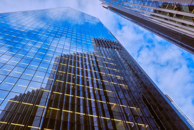 Low angle view of modern buildings against sky