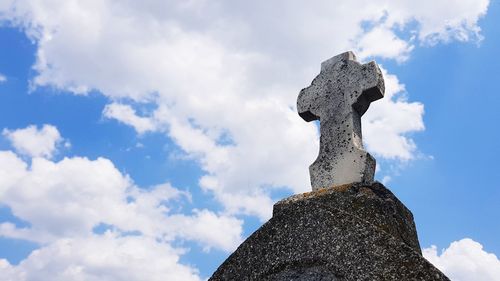 Low angle view of statue against sky