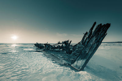 Scenic view of sea against sky during winter