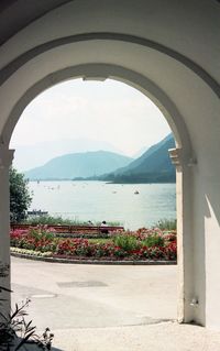 Scenic view of sea seen through arch