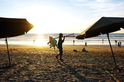 Man selling cotton candies on beach