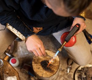 High angle view of woman working at workshop