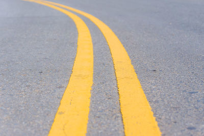 Close-up of yellow zebra crossing on road