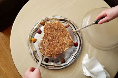 Midsection of person holding ice cream in plate