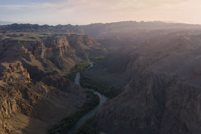 Aerial view of the charyn canyon and charyn river in kazakhstan, bestamak camping site, at sunset