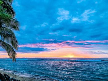 Scenic view of sea against sky at sunset