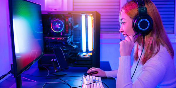 Young woman using mobile phone in recording studio