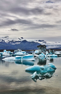 Scenic view of frozen lake against sky