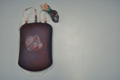 Close-up of jar with bottle against white background