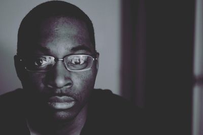 Close-up portrait of man wearing eyeglasses