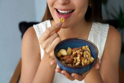 Midsection of woman holding food