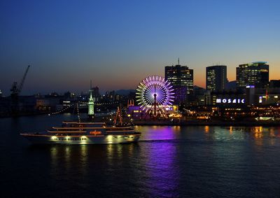 Illuminated buildings in city at night