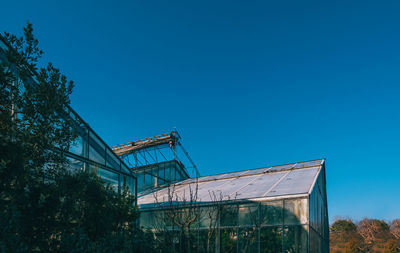 Low angle view of building against clear blue sky