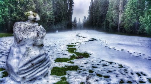 Statue of woman in park