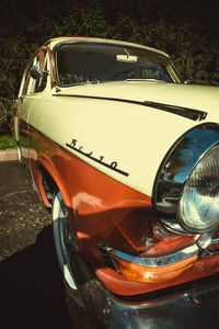 Close-up of vintage car on road