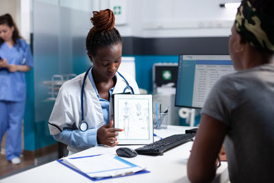 Side view of doctor working in office