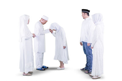 People standing against white background
