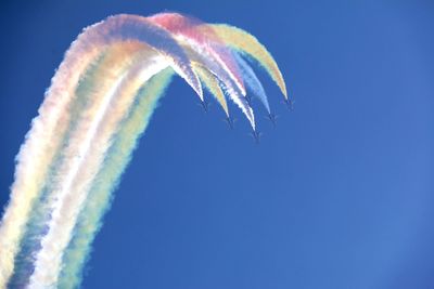 Close-up of vapor trails against blue sky