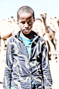 Portrait of young man standing outdoors