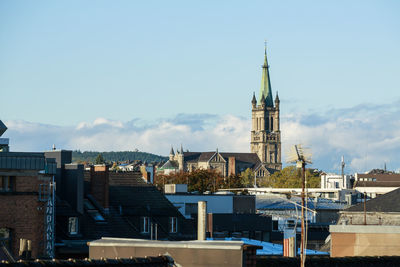 Buildings in city against sky