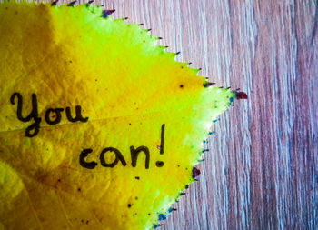 Close-up of yellow text
