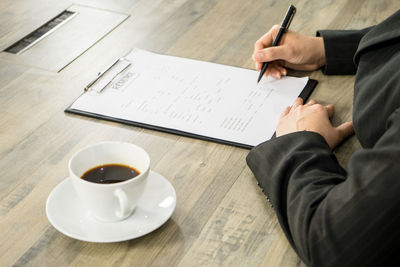 High angle view of coffee cup on table