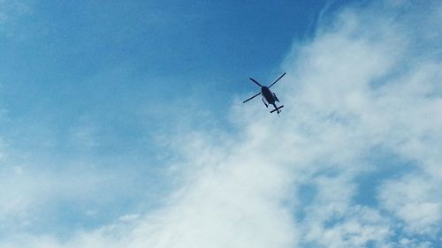 Low angle view of power lines against sky