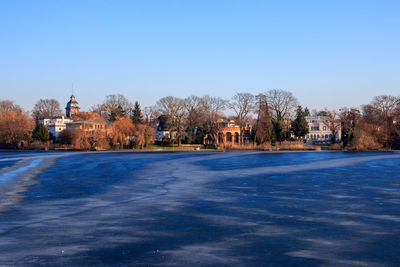 Scenic view of winter against blue sky