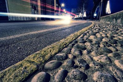 Light trails on road in city at night