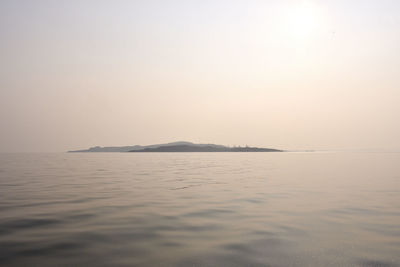 Scenic view of sea against clear sky during sunset