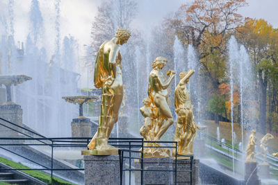 Statue against sky in city
