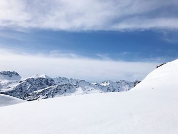 Snow covered mountains against sky