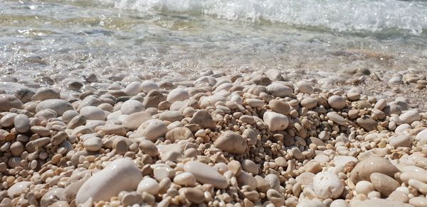 High angle view of pebbles on beach