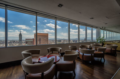 Empty chairs against the sky