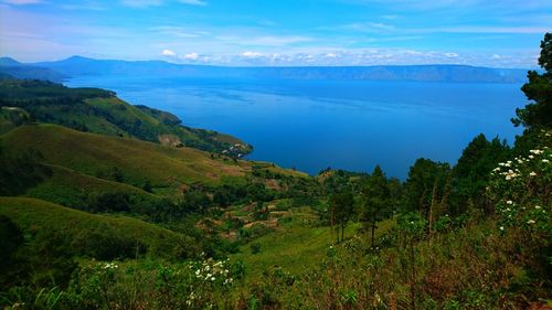 Scenic view of landscape and mountains against sky