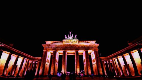 Low angle view of historical building at night