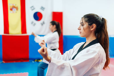 Young women practicing martial arts