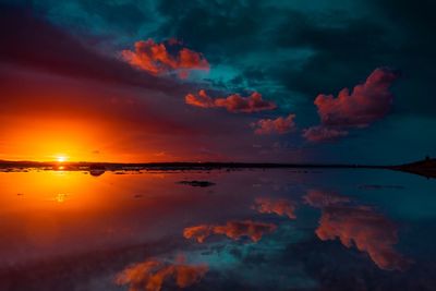 Scenic view of sea against romantic sky at sunset