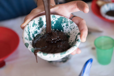 Cropped hand of woman holding ice cream