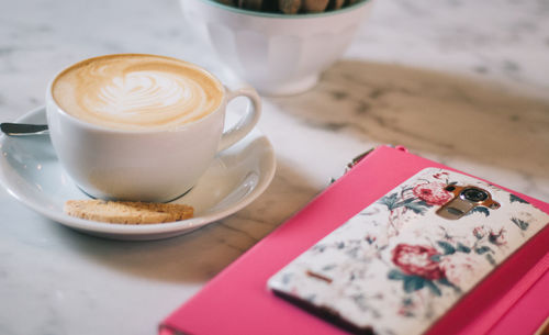 Close-up of cappuccino on table