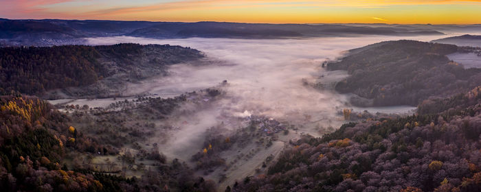 High angle view of mountains against sky during sunset