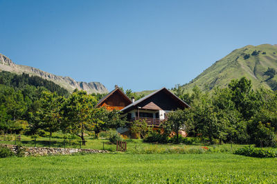 Scenic view of mountain chalets in summer. a mountain village in summer.