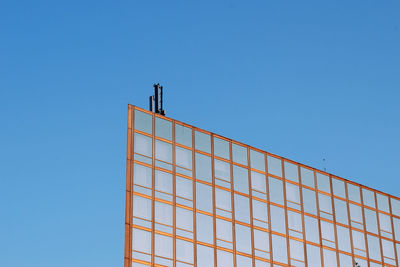 Low angle view of building against clear blue sky