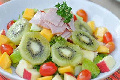 Close-up of chopped fruits in plate