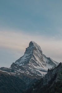 Scenic view of snowcapped mountain against sky