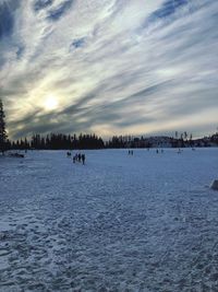 Scenic view of snow against sky during sunset