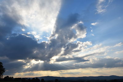 Scenic view of clouds over mountains